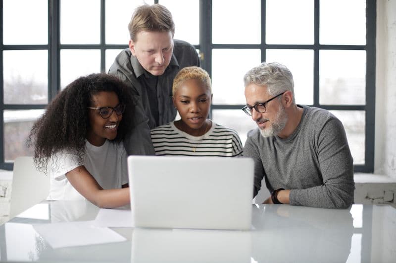 Diverse team collaborating in a modern workspace